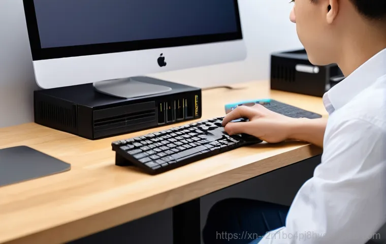 동소문동 해킨토시 재설치 포맷  초기화 - A gender-neutral person, dressed in a comfortable t-shirt and jeans, sits hunched over a desk in a d...