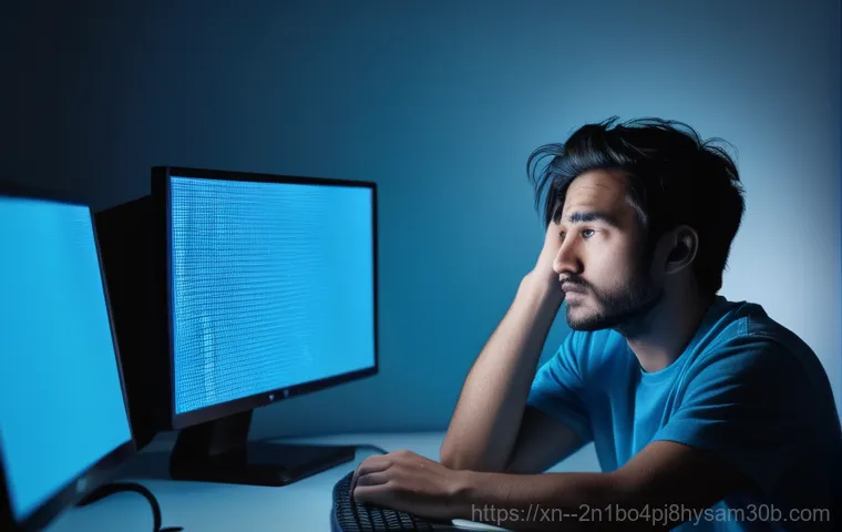 망원동 STATUS_KERNEL_THREAD_FAILURE - A focused young adult, casually dressed, sits at a desk, intently looking at a computer monitor disp...