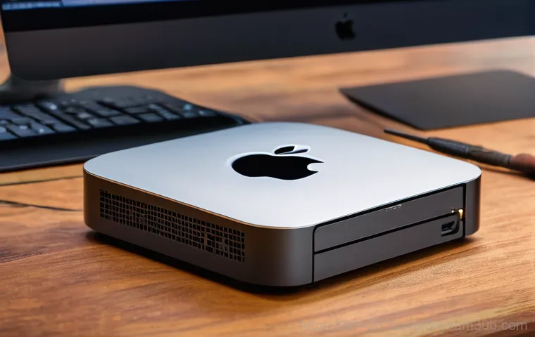 중곡동 맥미니 판매 및 수리 - A close-up, highly detailed shot focusing on the internal components of a Mac mini during a repair. ...