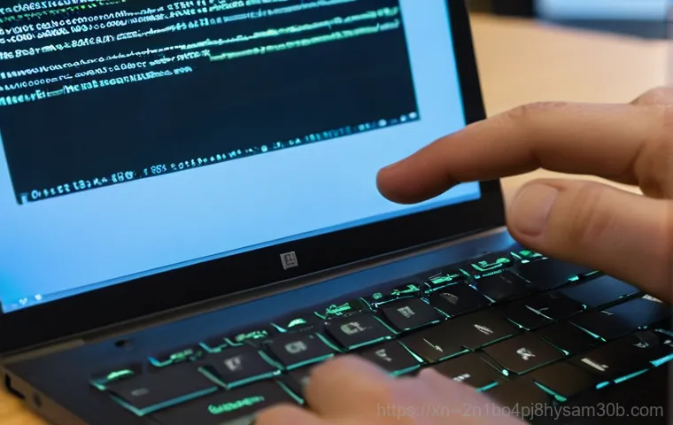 개봉동 STATUS_SYSTEM_FILE_MISSING - A person in their late 20s or early 30s, dressed in casual clothing, sitting at a desk in a dimly li...