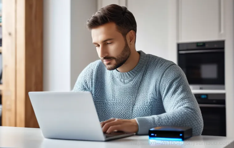 노고산동 NTFS_FILE_SYSTEM - An adult individual, wearing glasses and a focused expression, intently working on a laptop. The lap...