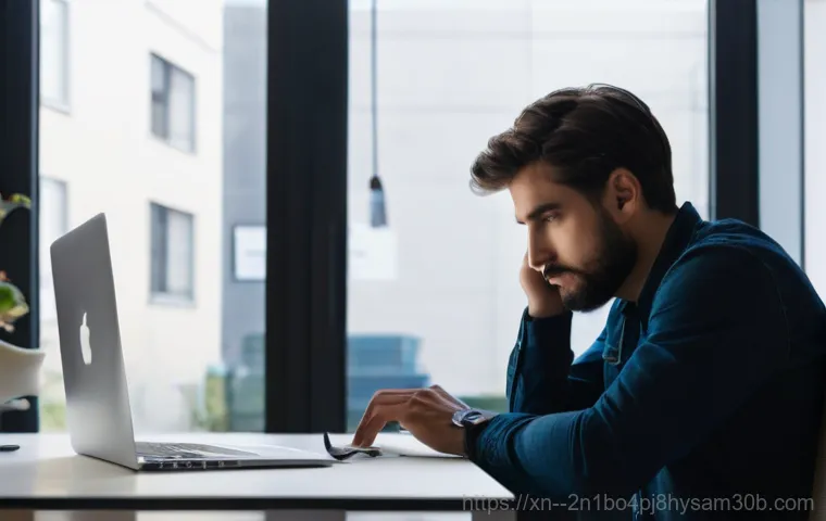 구기동 맥북프로 판매 및 수리 - A close-up shot of a modern MacBook Pro with a severely cracked and black screen, sitting on a clean...