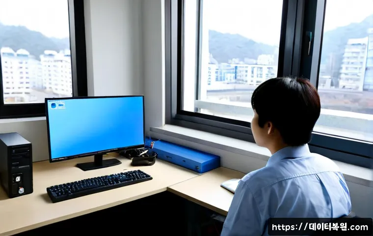 토정동 INTERNAL_POWER_ERROR - Photorealistic IT support workstation in a compact riverside neighborhood office, desktop tower open...