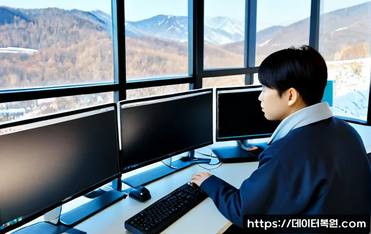은평구 STATUS_IO_TIMEOUT - Photorealistic remote-support workstation in Eunpyeong-gu, Seoul, dual monitors showing a frozen abs...