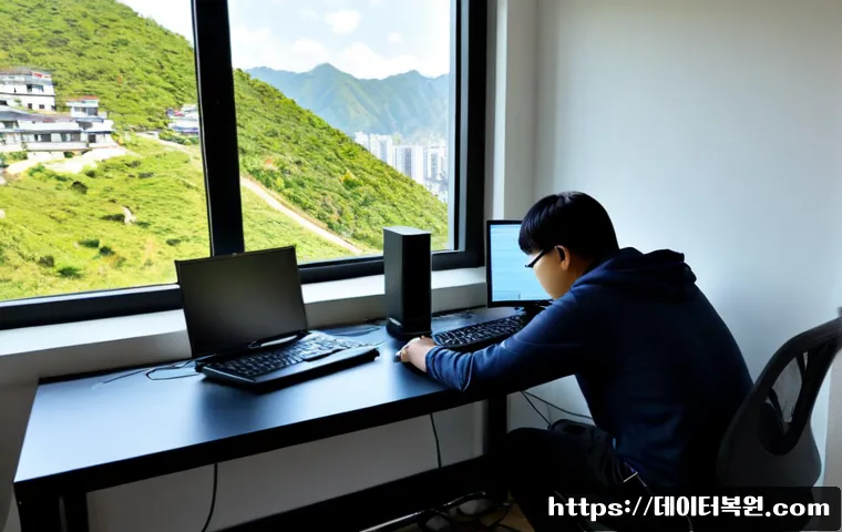 상도동 HARDWARE_FAILURE - Photorealistic remote-support workstation in a compact hillside apartment office, desktop tower open...