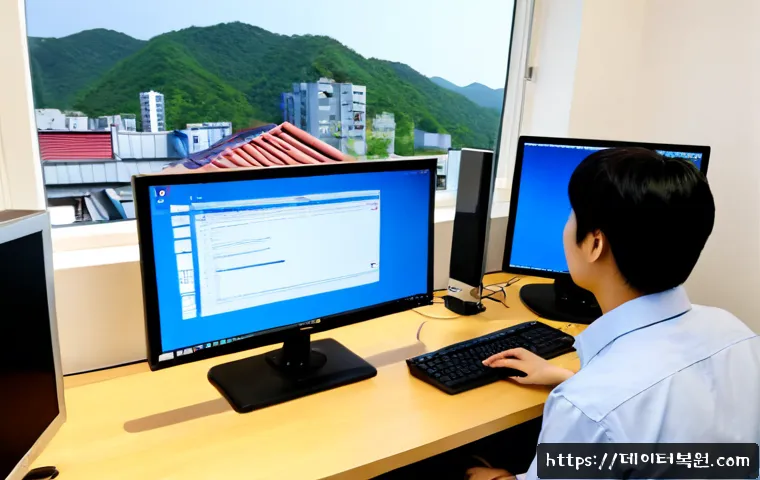 송정동 STATUS_KERNEL_HEAP_CORRUPTION - Photorealistic remote IT support workstation in Songjeong-dong, Seoul, dual monitors showing a blank...