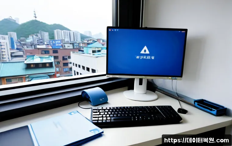 숭인동 STATUS_KERNEL_FILE_SYSTEM_ERROR - Photorealistic IT support workstation in a compact Sungin-dong apartment office, ultrawide monitor s...
